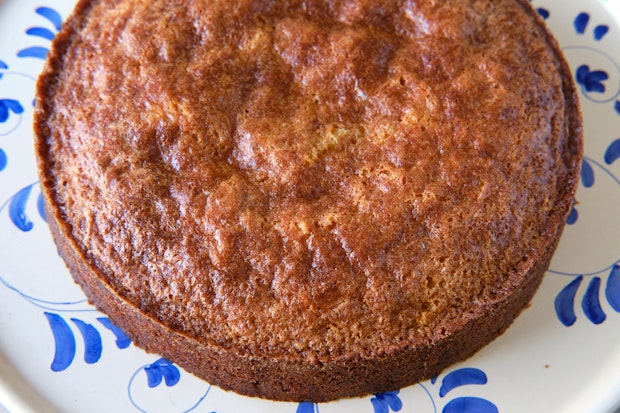 almond cake after baking on a serving plate