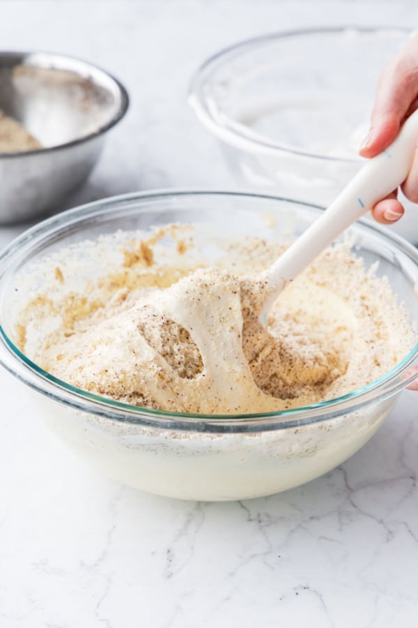 Folding in the hazelnut flour with a wide rubber spatula.