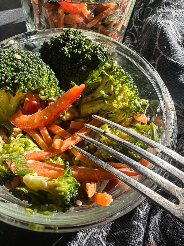 Thai Broccoli Salad – A crunchy, vibrant salad packed with bold flavors. Tossed with a zesty peanut dressing, this refreshing dish is perfect for meal prep, potlucks, or a light, nourishing meal. Find the recipe on Shutterbean.com #healthyrecipes #mealprep #saladlove #eattherainbow