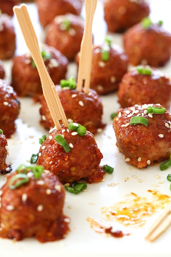 These Asian inspired turkey meatballs are seasoned with ginger and spices and finished with a sweet and spicy, gochujang glaze. Great as an appetizer or serve them with brown rice to make them a meal.