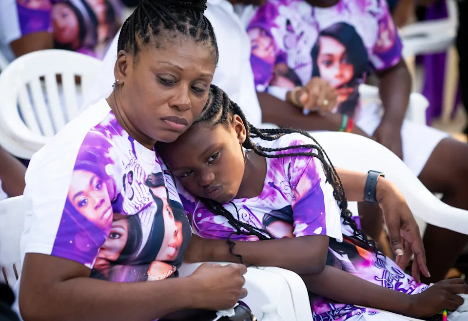 Pamela Dias, mom of Ajike Owens, comforts her granddaughter Afrika at a remembrance for Owens June 8, 2023 at the Immerse Church of Ocala.