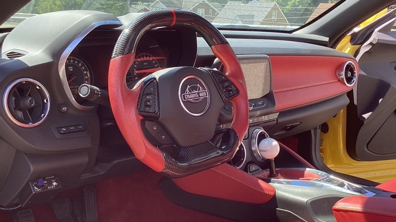 The red and black interior of a Trans Am Worldwide Super Duty Car