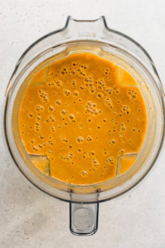 Easy pumpkin soup blended up in a blender.